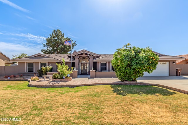 view of front of home featuring a garage and a front yard