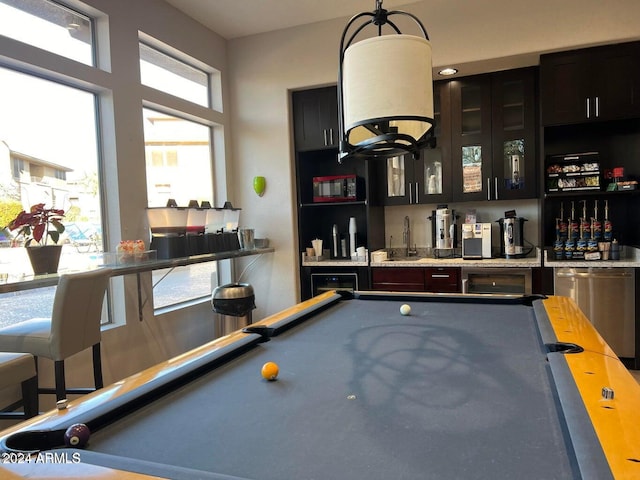 recreation room with pool table and wet bar