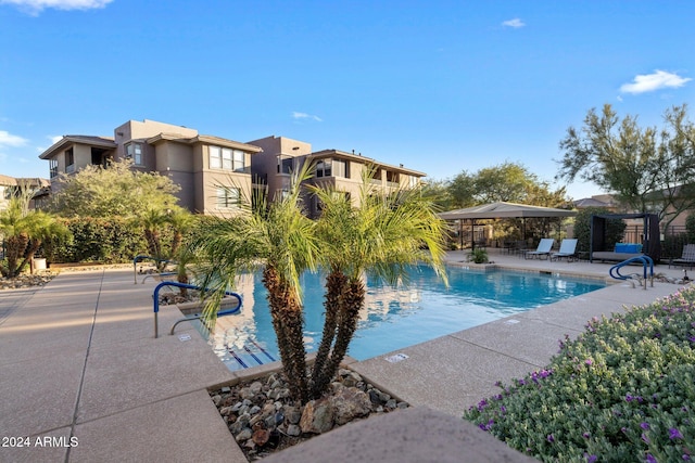 view of swimming pool with a patio area