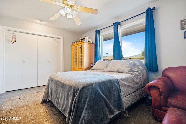 bedroom featuring hardwood / wood-style flooring, a closet, and ceiling fan