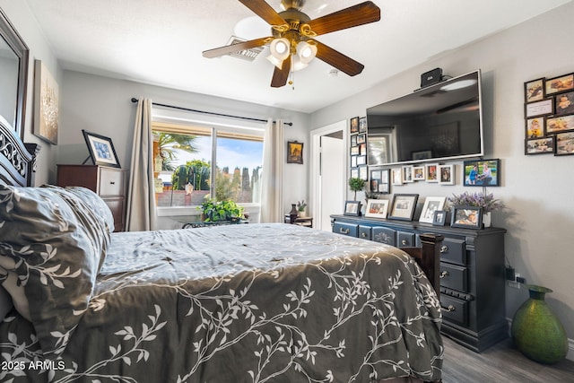 bedroom featuring ceiling fan and hardwood / wood-style flooring