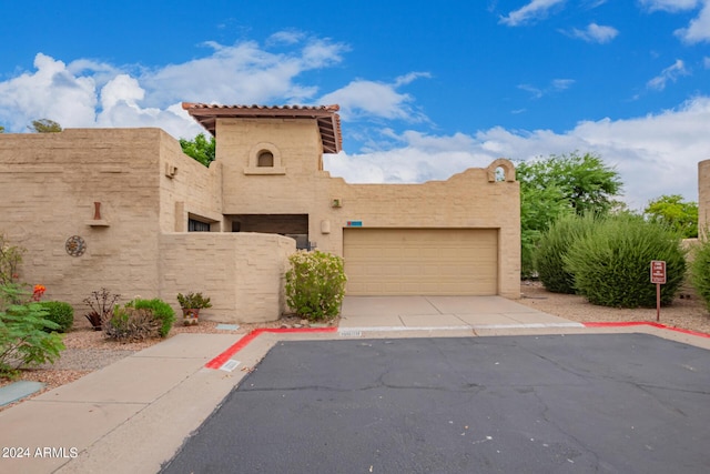 view of front of property with a garage