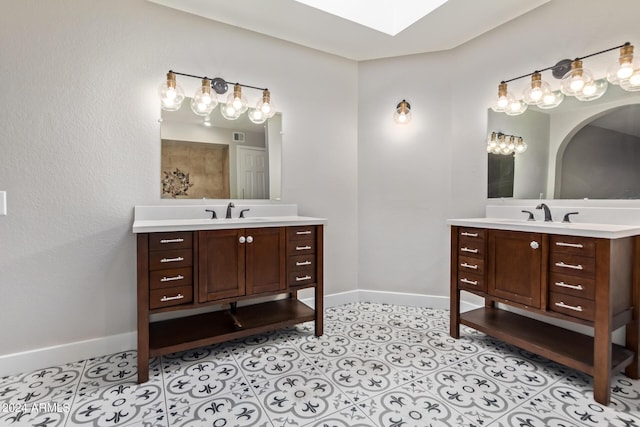 bathroom with tile patterned flooring and vanity