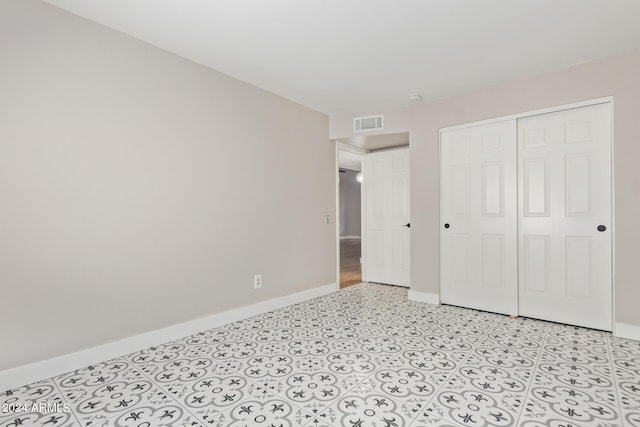 unfurnished bedroom featuring a closet