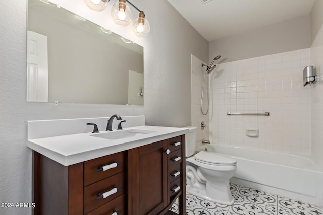 full bathroom featuring tile patterned flooring, vanity, toilet, and tiled shower / bath combo