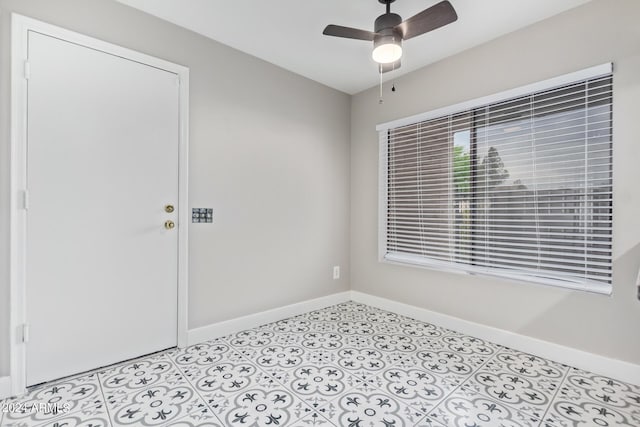 spare room with ceiling fan