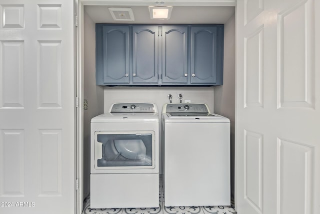 laundry area with cabinets and separate washer and dryer