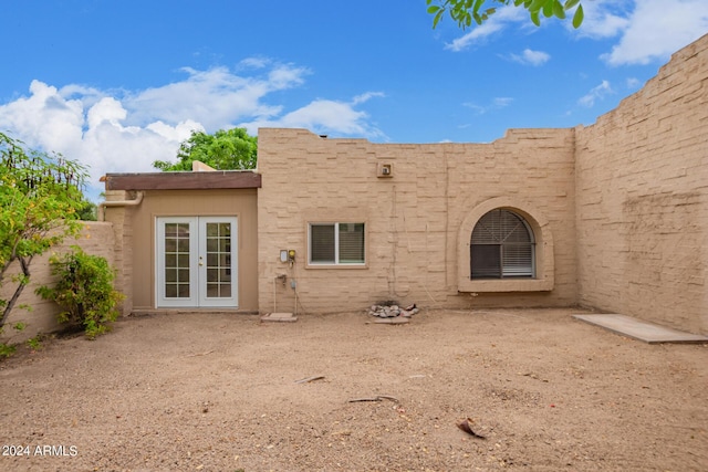 rear view of property with french doors