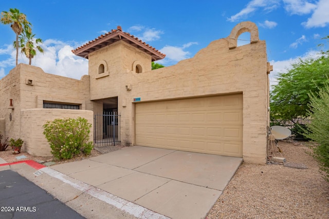 view of front of property with a garage