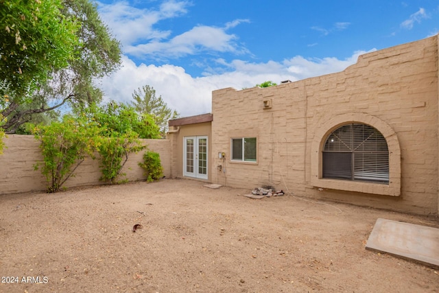 rear view of property featuring french doors