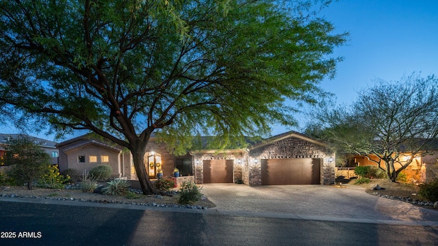 7130 E Saddleback St Unit 58, Mesa, AZ 85207 - ranch-style house with a garage, driveway, and stone siding