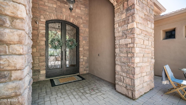 7130 E Saddleback St Unit 58, Mesa, AZ 85207 - entrance to property featuring french doors and stone siding