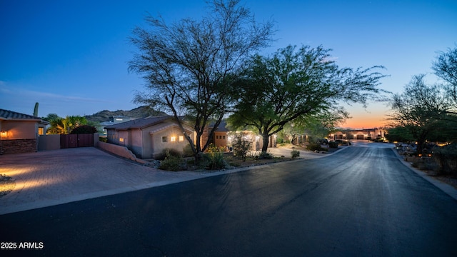 7130 E Saddleback St Unit 58, Mesa, AZ 85207 - view of asphalt street with a gate