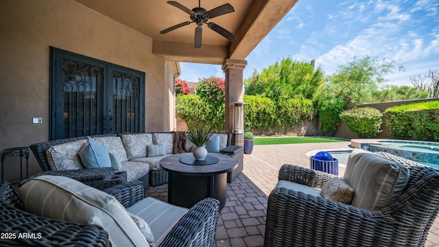 7130 E Saddleback St Unit 58, Mesa, AZ 85207 - view of patio with a ceiling fan, an in-ground hot tub, an outdoor hangout area, and a fenced backyard