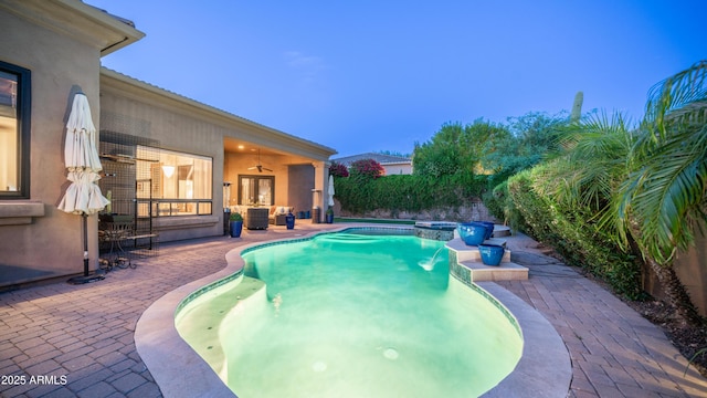 7130 E Saddleback St Unit 58, Mesa, AZ 85207 - view of swimming pool featuring a patio area, ceiling fan, central AC unit, and a pool with connected hot tub