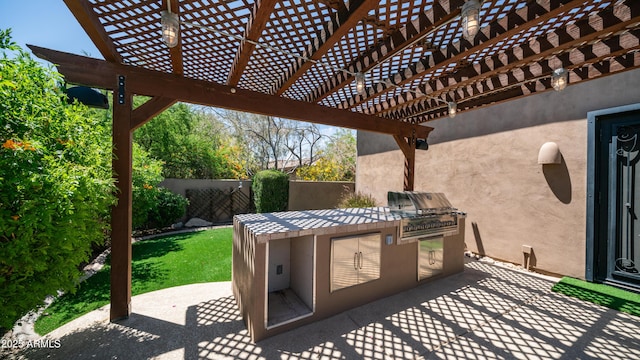 7130 E Saddleback St Unit 58, Mesa, AZ 85207 - view of patio / terrace featuring a grill, an outdoor kitchen, fence, and a pergola