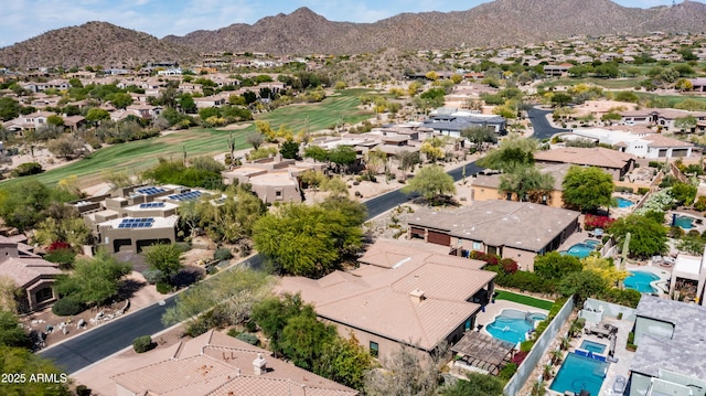 7130 E Saddleback St Unit 58, Mesa, AZ 85207 - aerial perspective of suburban area with a pool area, a mountain backdrop, and a golf course
