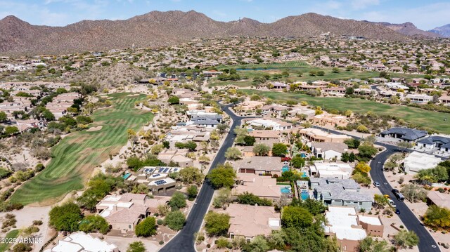 7130 E Saddleback St Unit 58, Mesa, AZ 85207 - aerial overview of property's location with a golf club, nearby suburban area, and a mountain backdrop
