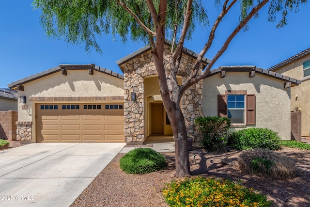 17138 W Las Palmaritas Dr, Waddell, AZ 85355 - mediterranean / spanish-style house with a garage, stone siding, stucco siding, concrete driveway, and a tile roof