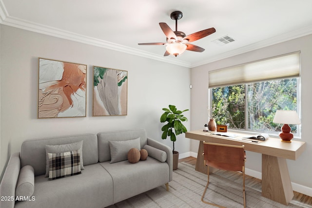 home office featuring ornamental molding, light hardwood / wood-style floors, and ceiling fan