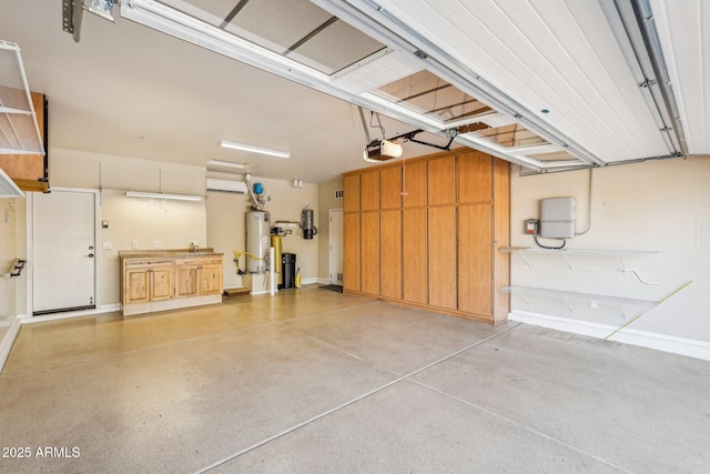 garage featuring a garage door opener and water heater