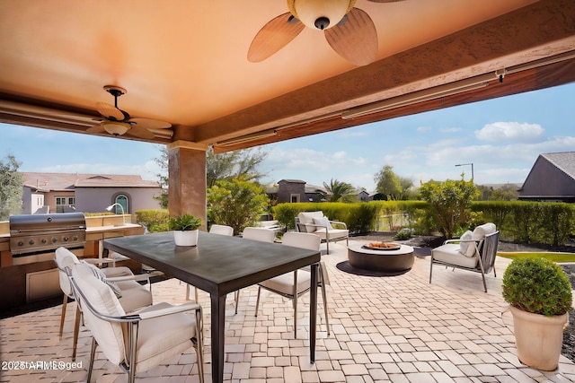 view of patio / terrace featuring area for grilling, a grill, and an outdoor fire pit