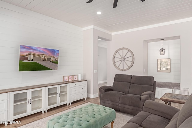 living room with wood ceiling, ceiling fan, and light hardwood / wood-style floors