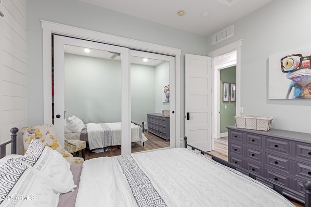 bedroom featuring wood-type flooring and a closet