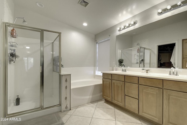 bathroom featuring vanity, tile patterned floors, and separate shower and tub