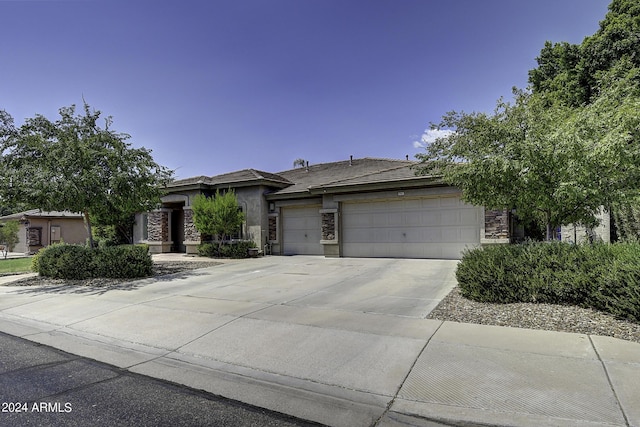 prairie-style home featuring a garage