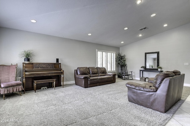 carpeted living room featuring lofted ceiling