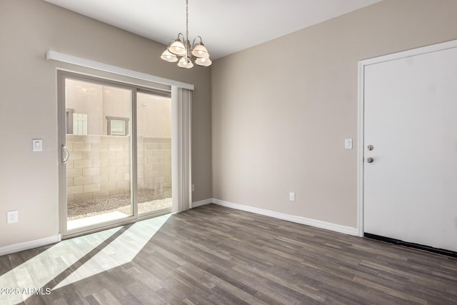 917 E Agua Fria Ln, Avondale, AZ 85323 - spare room featuring wood finished floors, a chandelier, and baseboards
