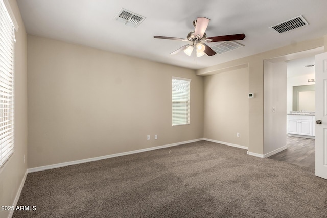 917 E Agua Fria Ln, Avondale, AZ 85323 - carpeted empty room with ceiling fan and baseboards