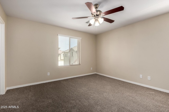 917 E Agua Fria Ln, Avondale, AZ 85323 - spare room with carpet, ceiling fan, and baseboards