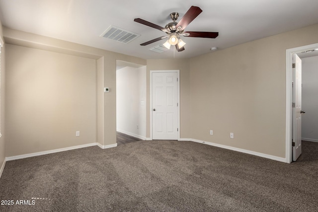 917 E Agua Fria Ln, Avondale, AZ 85323 - unfurnished bedroom featuring dark carpet, baseboards, and ceiling fan