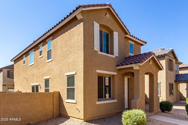 917 E Agua Fria Ln, Avondale, AZ 85323 - view of side of home featuring a tiled roof and stucco siding