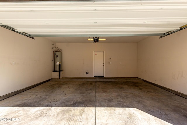917 E Agua Fria Ln, Avondale, AZ 85323 - garage featuring electric water heater, a garage door opener, and baseboards