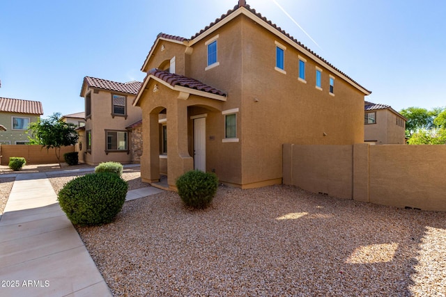 917 E Agua Fria Ln, Avondale, AZ 85323 - view of front of house featuring stucco siding and a tiled roof