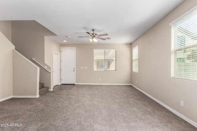 917 E Agua Fria Ln, Avondale, AZ 85323 - unfurnished living room featuring carpet floors, ceiling fan, stairway, and baseboards