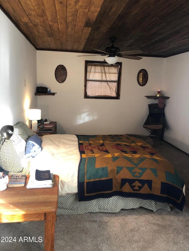 bedroom featuring carpet flooring, ceiling fan, and wooden ceiling