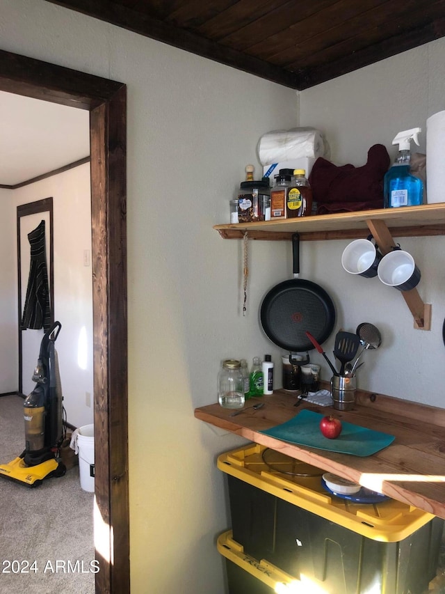 room details with carpet floors and wood ceiling