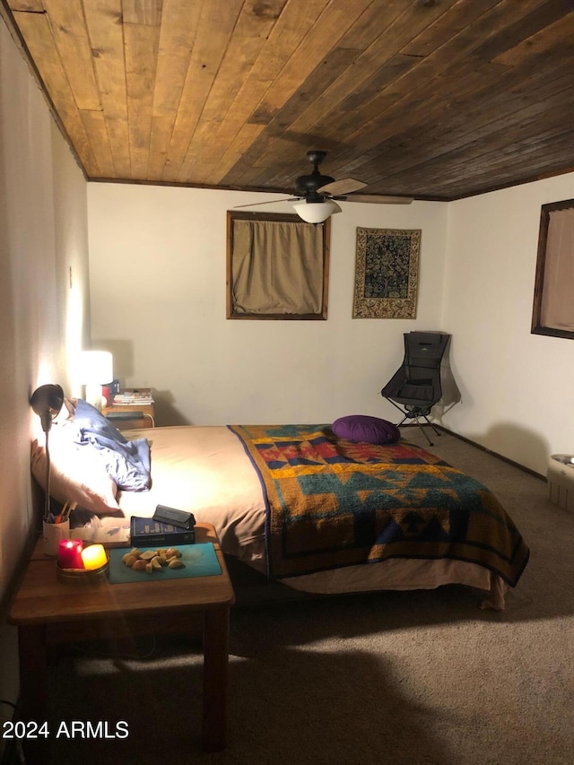 carpeted bedroom with ceiling fan and wooden ceiling