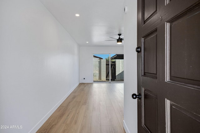 corridor with light wood-type flooring