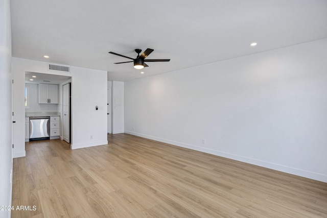 unfurnished living room featuring ceiling fan and light wood-type flooring