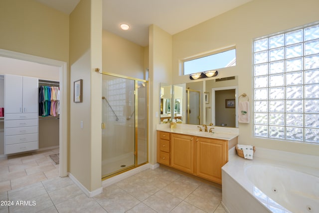 bathroom with tile patterned floors, plenty of natural light, and independent shower and bath