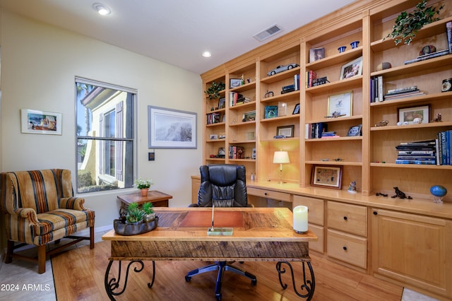 home office featuring light hardwood / wood-style floors