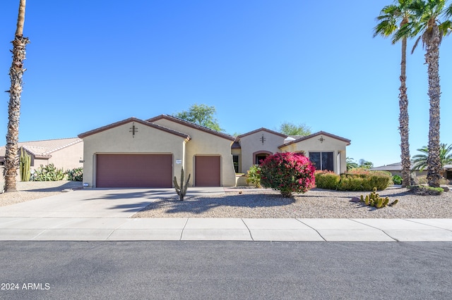 mediterranean / spanish-style house featuring a garage