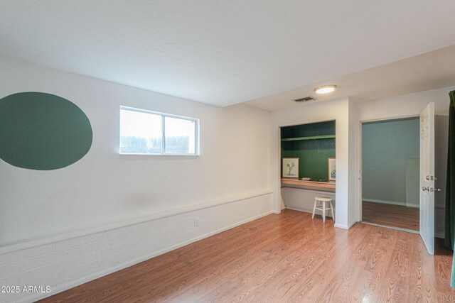 512 N Ironwood, Mesa, AZ 85201 - empty room with light wood-style flooring and a wainscoted wall