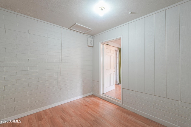 512 N Ironwood, Mesa, AZ 85201 - unfurnished room featuring attic access, baseboards, and light wood-type flooring