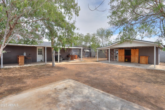 512 N Ironwood, Mesa, AZ 85201 - back of property featuring a patio and an outbuilding